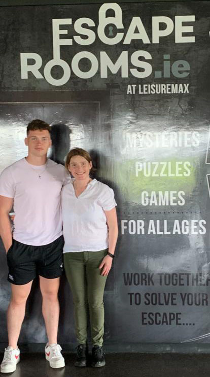 Image of Aileen Whelan and Josh her nephew standing in front of Escape Rooms Wexford Wall